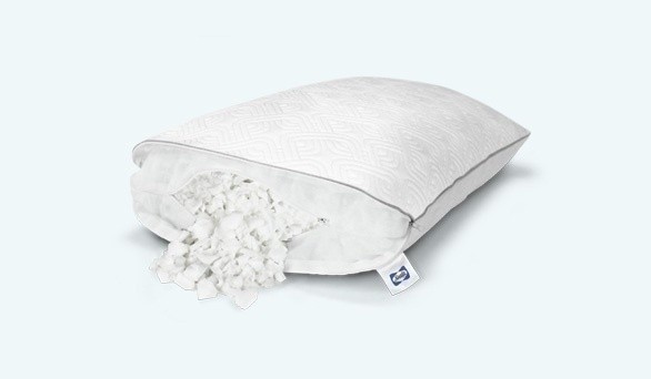A Sealy Adjustable pillow, with one side of the pillow cover unzipped, so you can see the filling pieces inside