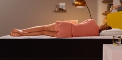 Woman sleeping on side on Cocoon mattress